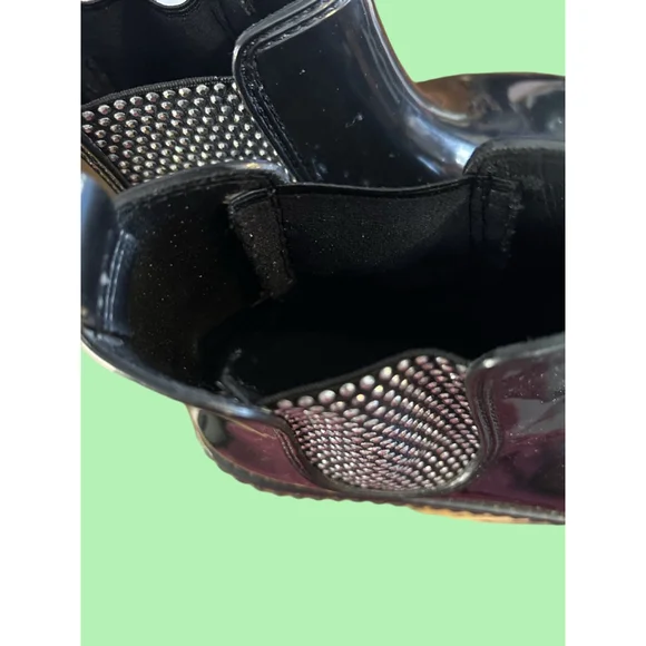Women's Michael Kors black patent Lulu PVC Chelsea boot with stud accents.